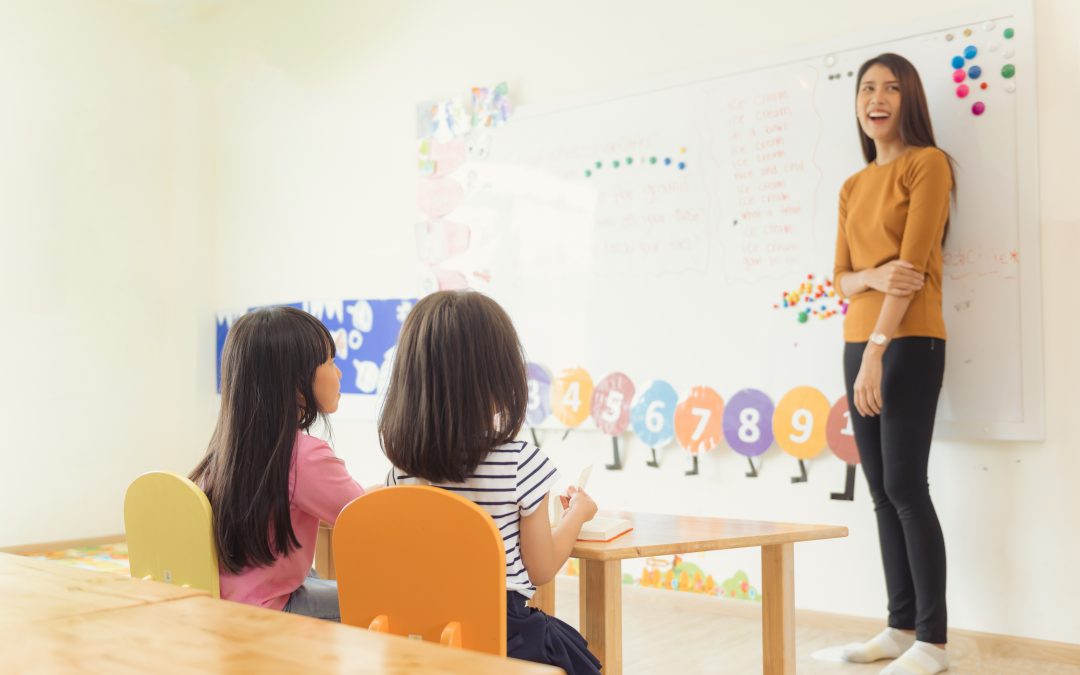 education elementary school learning and people concept group of school kids with teacher sitting in classroom vintage effect style pictures